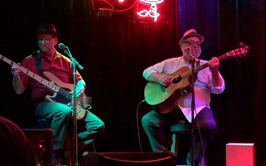 Ron and drummer Tim Lewis performing on a club stage